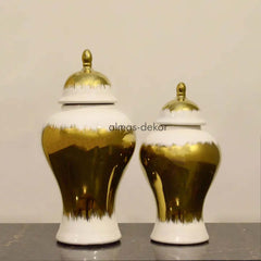 Gold and White Ceramic Urn Set