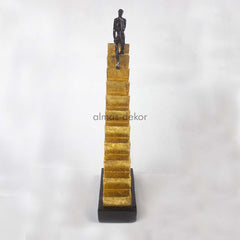 Resin Man Statue Sitting On Stairs with contemplative pose