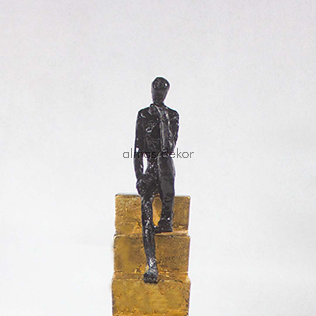 Resin Man Statue Sitting On Stairs with contemplative pose